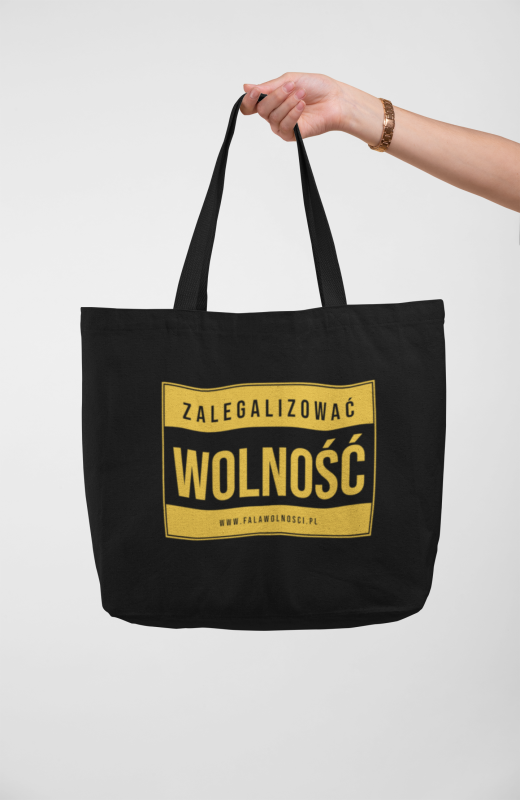 mockup-of-a-hand-holding-a-tote-bag-against-a-solid-color-background-28835