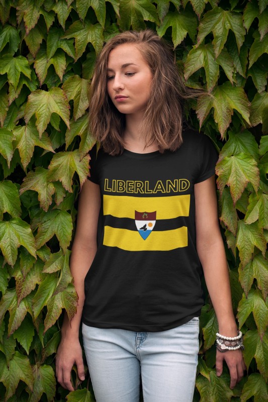 t-shirt-mockup-of-a-young-woman-leaning-on-a-wall-of-ivy-2761-el1