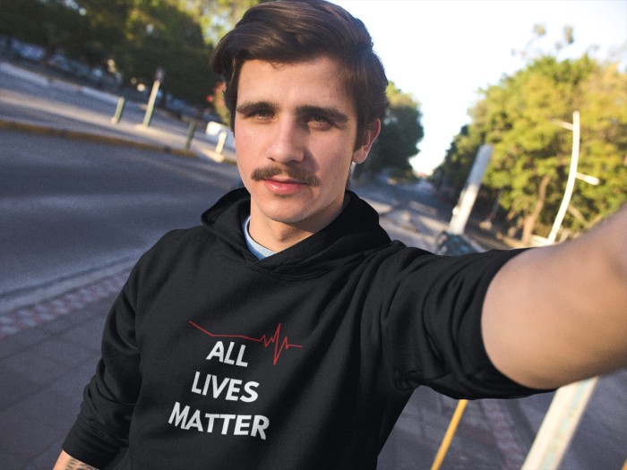 selfie-mockup-of-a-young-white-man-with-moustache-wearing-a-pullover-hoodie-while-in-the-city-a13610